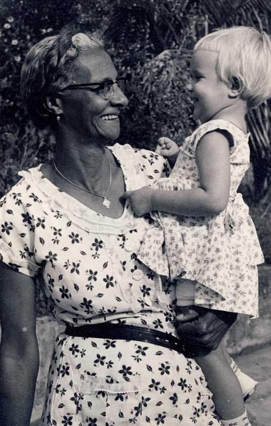 Although she had no children of her own she loved the “little people” as can be seen here.