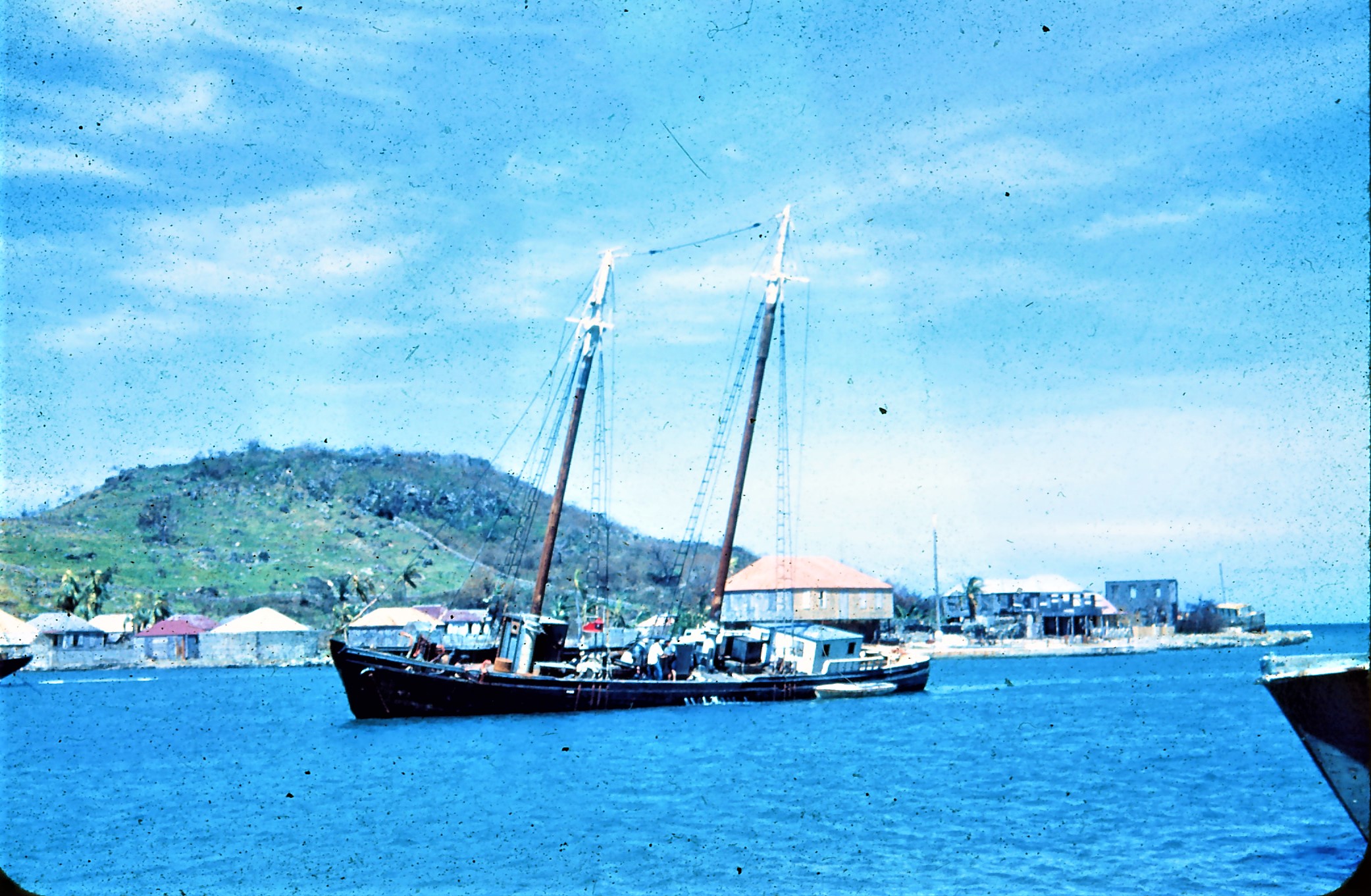 Schooner Roma with Charles Thomas Barnes' home in background.